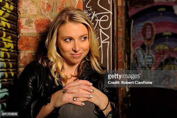 Racing driver Amber Anderson poses for a portrait session in a Melbourne CBD laneway on July 23, 2009 in Melbourne, Australia.