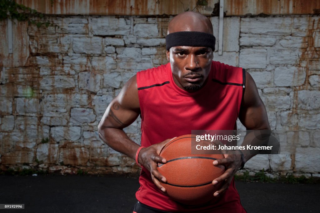Portrait of basketball player in urban setting