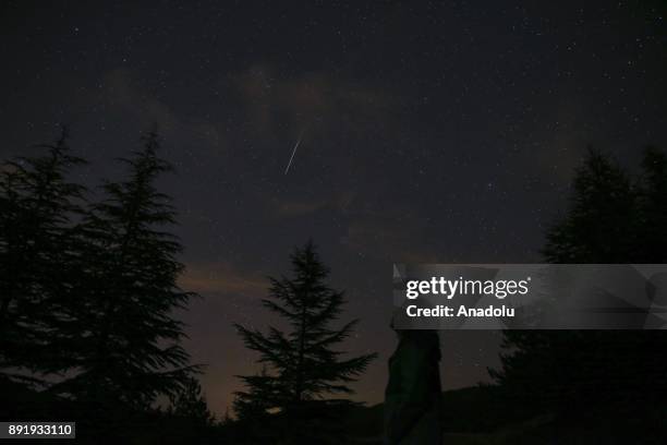 Meteors named as 'Geminid' streak across the sky over Turkey's Ankara on December 14, 2017.