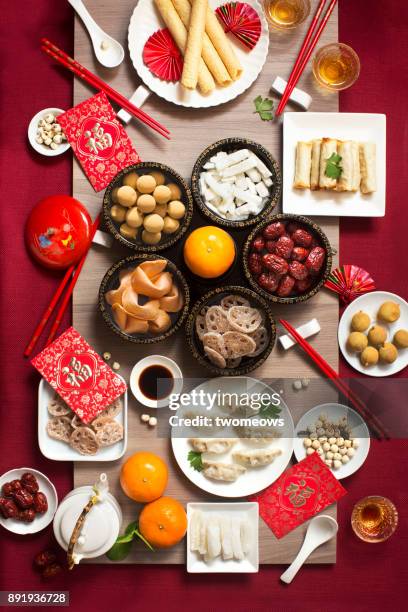 flat lay chinese new year reunion dinner, food and drink. marble top background. - lunar new year cup 2017 stock-fotos und bilder