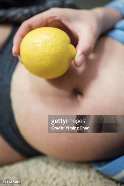 belly of a pregnant women - 5 months fetus stock pictures, royalty-free photos & images