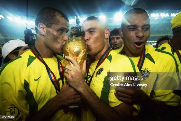 Rivaldo and Ronaldo of Brazil kiss the trophy after the Germany v Brazil, World Cup Final match played at the International Stadium Yokohama in...