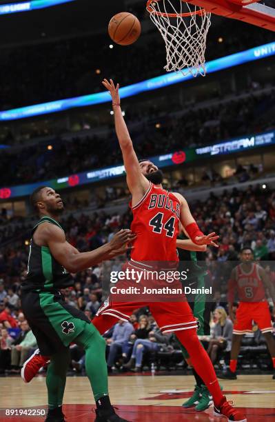 Nikola Mirotic of the Chicago Bulls shoots over Semi Ojeleye of the Boston Celtics on his way to a game-high 24 points at the United Center on...