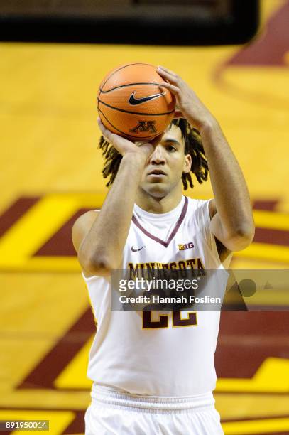 Reggie Lynch of the Minnesota Golden Gophers shoots a free throw against the Drake Bulldogs during the game on December 11, 2017 at Williams Arena in...