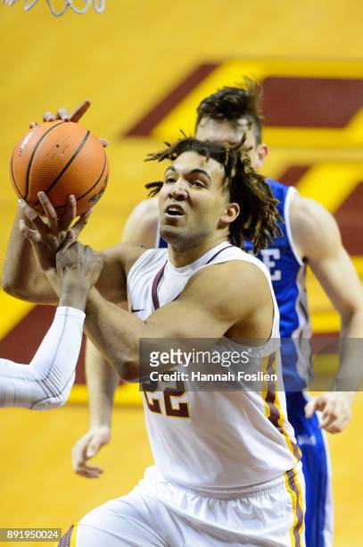 Reggie Lynch of the Minnesota Golden Gophers is fouled while shooting the ball against the Drake Bulldogs during the game on December 11, 2017 at...
