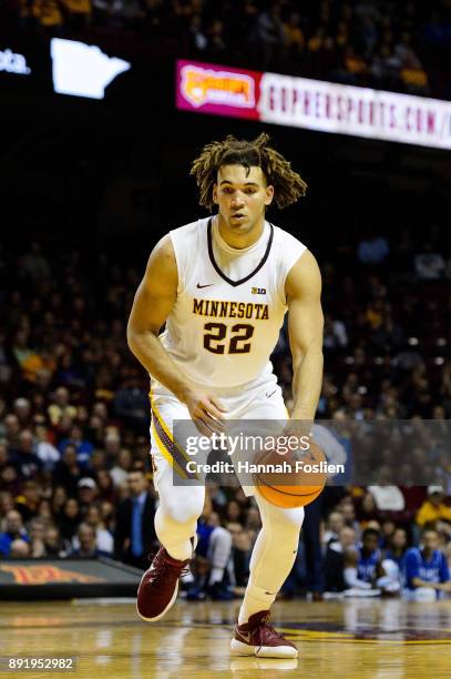 Reggie Lynch of the Minnesota Golden Gophers dribbles the ball against the Drake Bulldogs during the game on December 11, 2017 at Williams Arena in...