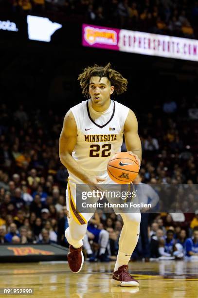 Reggie Lynch of the Minnesota Golden Gophers dribbles the ball against the Drake Bulldogs during the game on December 11, 2017 at Williams Arena in...