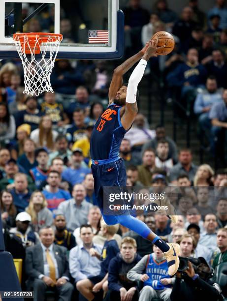 Paul George of the Oklahoma City Thunder goes up to dunk the ball against the Indiana Pacers at Bankers Life Fieldhouse on December 13, 2017 in...