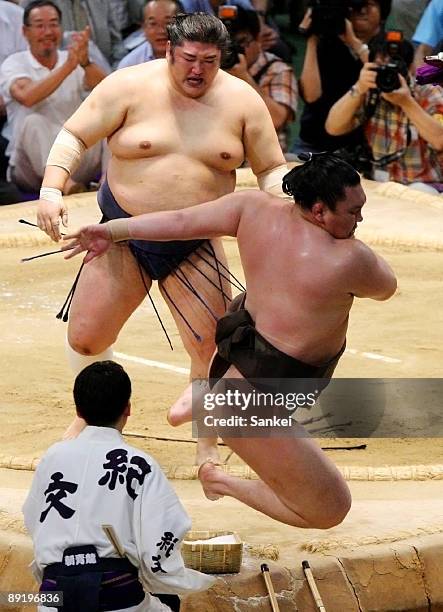 Kotomitsuki beats grand champion Hakuho by Yorikiri during Sumo Nagoya Tournament Day 11 at Aichi Prefecture Gymnasium on July 22, 2009 in Nagoya,...
