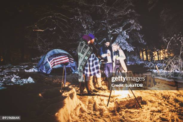 friends camping on snowy mountain - woodland cafe stock pictures, royalty-free photos & images