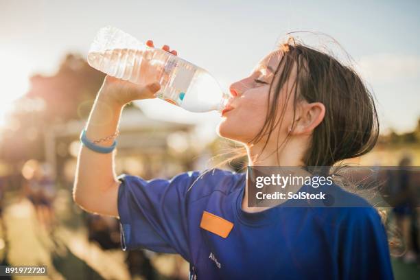 water is the fuel for exercise! - kids athletics stock pictures, royalty-free photos & images