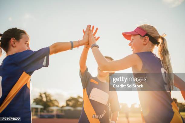 team celebration in athletics club - young athlete stock pictures, royalty-free photos & images