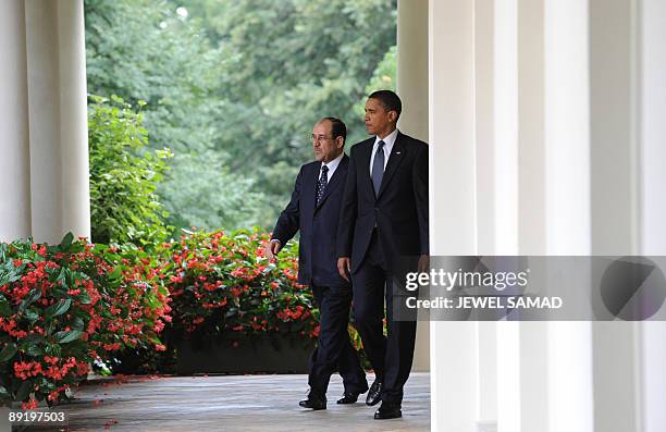 President Barack Obama and Iraqi Prime Minister Nuri al-Maliki arrive to give a joint press conference following their meeting at the Rose Garden in...