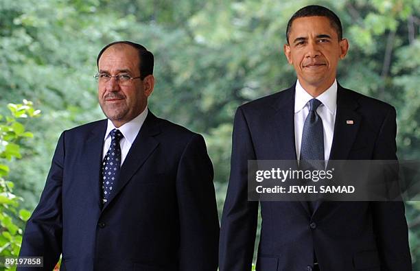 President Barack Obama and Iraqi Prime Minister Nuri al-Maliki arrive to give a joint press conference following their meeting at the Rose Garden in...