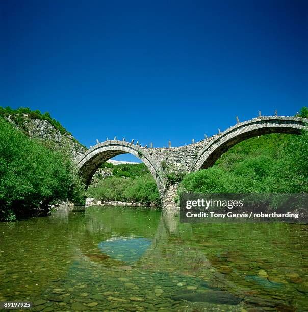 arches of the turkish bridge over the river at kipi, greece, europe - kipi stock pictures, royalty-free photos & images