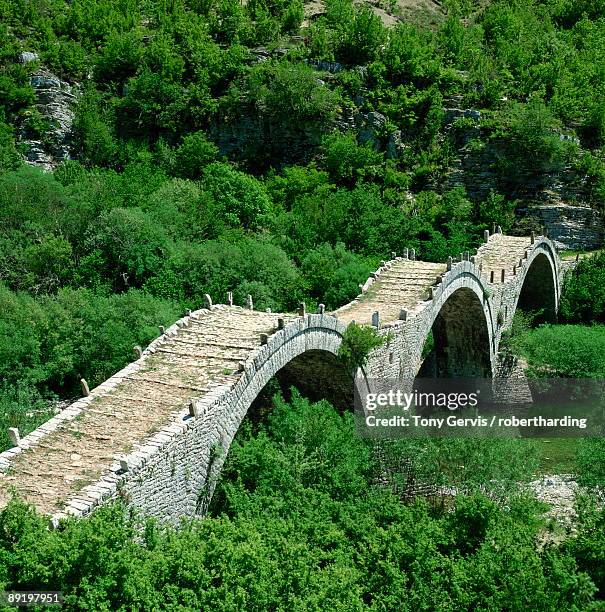 oldturkish bridge over the river at kipi, greece, europe - kipi stock pictures, royalty-free photos & images