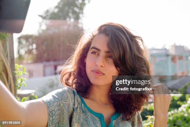 arab youth: young woman makes a selfie of herself - moroccan woman stock pictures, royalty-free photos & images