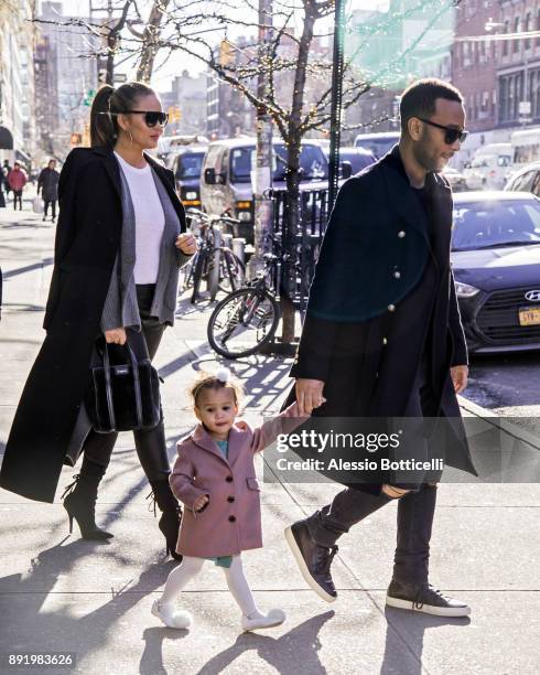 John Legend, Chrissy Teigen and their daughter Luna are seen leaving their hotel on December 12, 2017 in New York, New York.