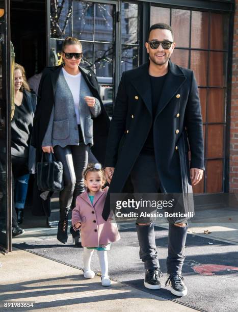 John Legend, Chrissy Teigen and their daughter Luna are seen leaving their hotel on December 12, 2017 in New York, New York.
