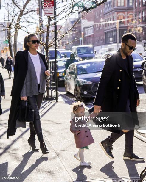 John Legend, Chrissy Teigen and their daughter Luna are seen leaving their hotel on December 12, 2017 in New York, New York.