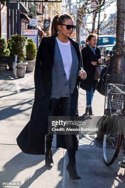 Chrissy Teigen is seen leaving her hotel on December 12, 2017 in New York, New York.