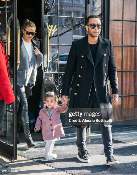 John Legend, Chrissy Teigen and their daughter Luna are seen leaving their hotel on December 12, 2017 in New York, New York.