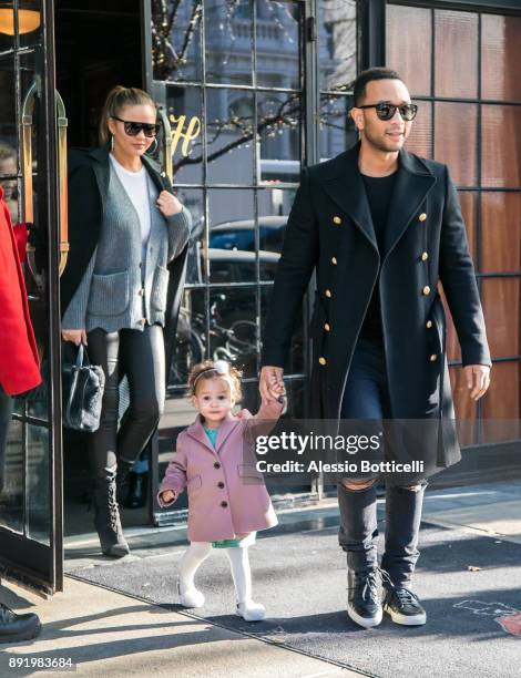 John Legend, Chrissy Teigen and their daughter Luna are seen leaving their hotel on December 12, 2017 in New York, New York.