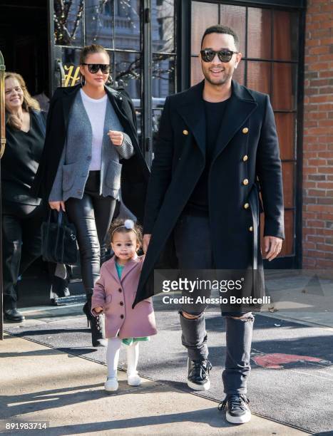 John Legend, Chrissy Teigen and their daughter Luna are seen leaving their hotel on December 12, 2017 in New York, New York.