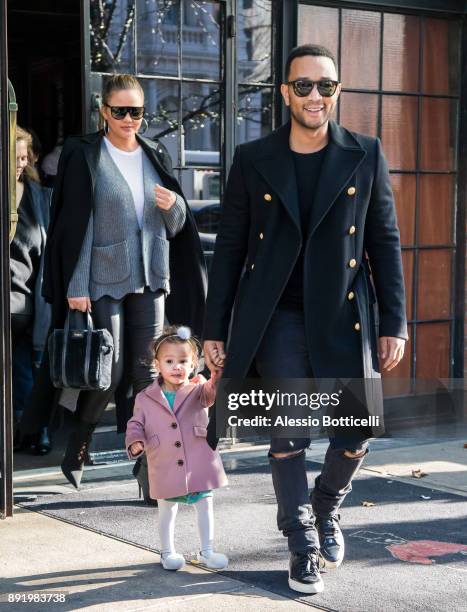 John Legend, Chrissy Teigen and their daughter Luna are seen leaving their hotel on December 12, 2017 in New York, New York.