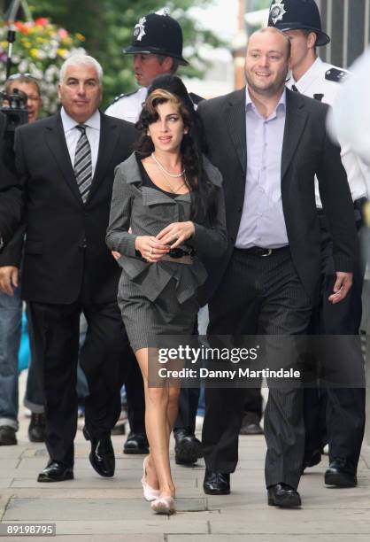 Amy Winehouse attends court to face assault charges at Westminster Magistrates Court on July 23, 2009 in London, England. It is claimed that the...