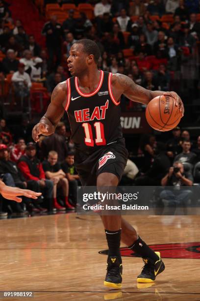 Dion Waiters of the Miami Heat handles the ball against the Portland Trail Blazers on December 13, 2017 at American Airlines Arena in Miami, Florida....