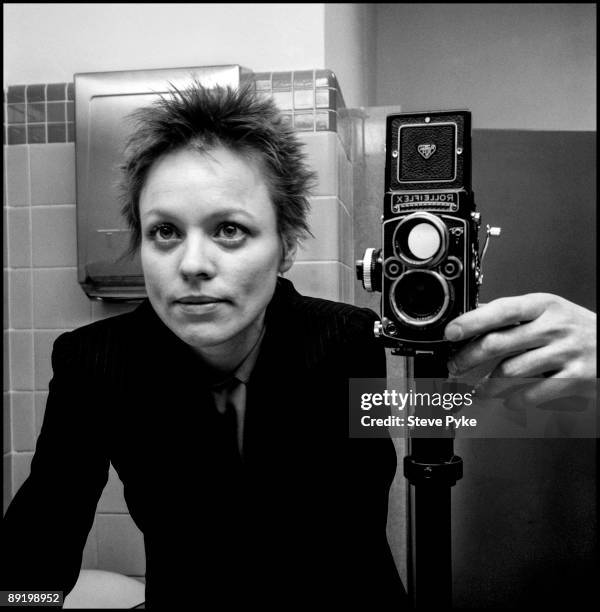 Photographer Steve Pyke photographs the reflection of American artist and avant garde musician Laurie Anderson in a bathroom mirror, New York City,...