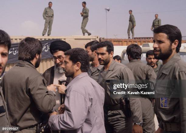 Iranian President Ayatollah Seyyed Ali Khamenei with Revolutionary Guards during the funeral of Ayatollah Khomeini at Behesht Zahra cemetery, Tehran...