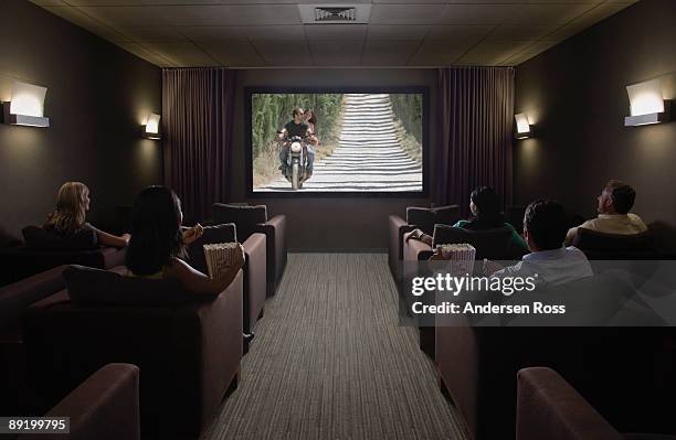 watching movie in home theater - home cinema stockfoto's en -beelden