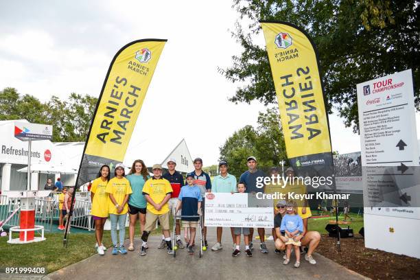 Ceremonial check presented to the AFLAC Cancer Center is displayed during the Arnie's Army Charitable Foundation's Arnie's March held following...
