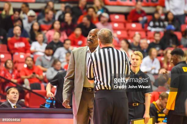 Head coach Al Skinner of the Kennesaw State Owls talks with an official at a time out during the first half of the game against the Texas Tech Red...