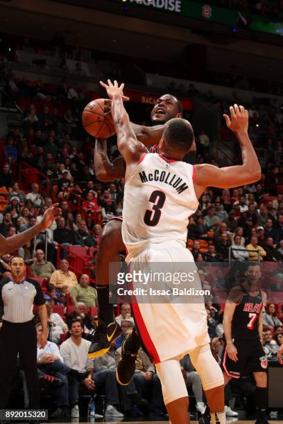 Dion Waiters of the Miami Heat goes to the basket against the Portland Trail Blazers on December 13, 2017 at American Airlines Arena in Miami,...