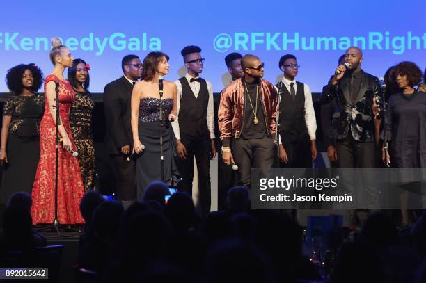 Gloria Reuben, Usher and Alfre Woodard perform onstage during Robert F. Kennedy Human Rights Hosts Annual Ripple Of Hope Awards Dinner on December...