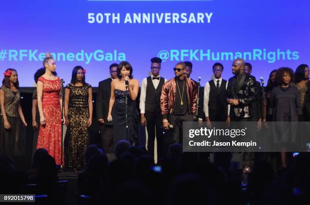 Gloria Reuben, Usher and Alfre Woodard perform onstage during Robert F. Kennedy Human Rights Hosts Annual Ripple Of Hope Awards Dinner on December...