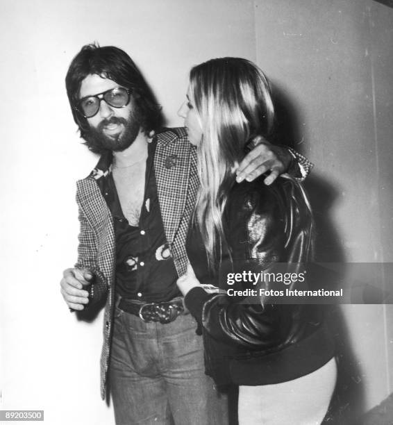 American actress and singer Barbra Streisand with her boyfriend, producer Jon Peters, October 1974. They are leaving a Bistro party for Elton John.