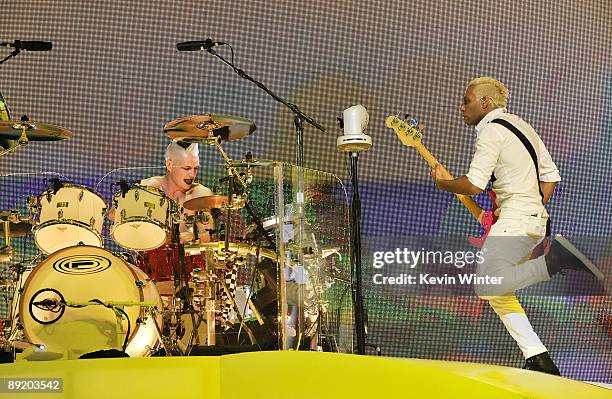 Drummer Adrian Young and bass player Tony Kanal of the rock band No Doubt perform at the Gibson Amphitheatre on July 22, 2009 in Universal City,...