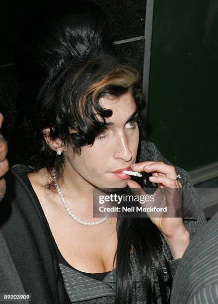 Amy Winehouse attends court to face assault charges at Westminster Magistrates Court on July 23, 2009 in London, England. It is claimed that the...