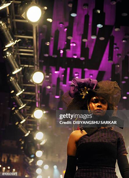 An Indian model walks the ramp as she presents the creation of designer Abhi & Rahul during the first day of the Bangalore Fashion Week 09 in...