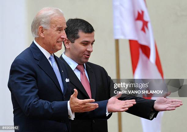 Vice President Joe Biden gestures as Georgian speaker of parliament David Bakradze introduces Biden to parliamentarians in Tbilisi on July 23, 2009....