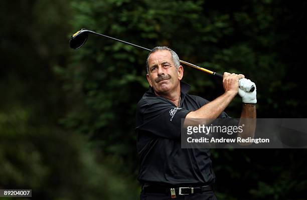 Sam Torrance of Scotland tees off on the ninth hole during the first round of The Senior Open Championship presented by MasterCard held on the Old...