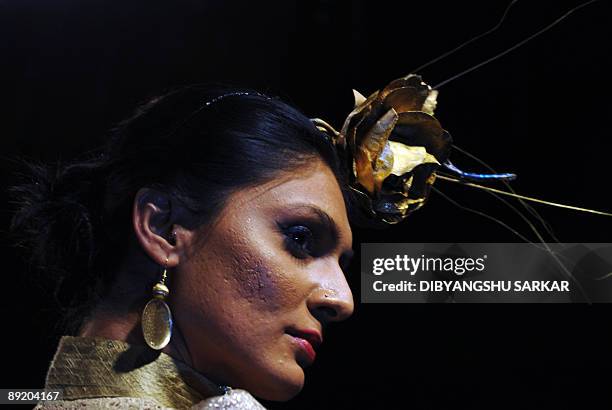 An Indian model walk the ramp as she present the creation of designer Neelam Ashley during the first day of the Bangalore Fashion Week 09, in...