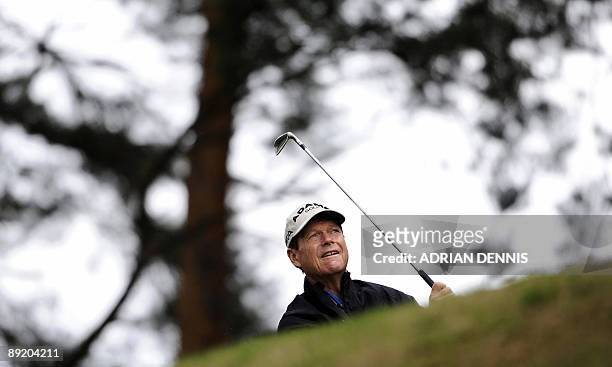 Golfer Tom Watson watches his shot off the 13th tee during the Senior Open Championship at the Sunningdale Golf Club in Sunningdale, on July 23,...