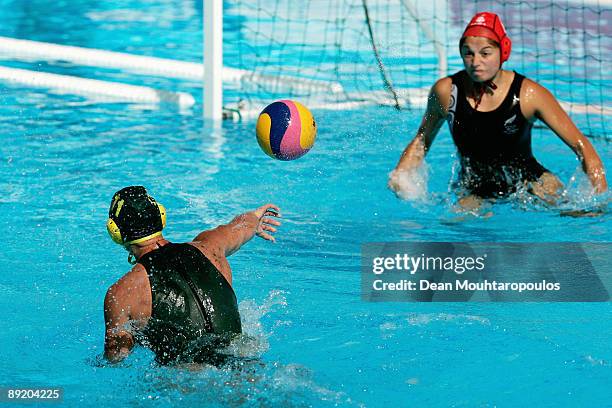 Nicola Zagame of Australia shoots and scores past goalkeeper Carina Harache of New Zealand at the Womens Water Polo match between Australia and New...