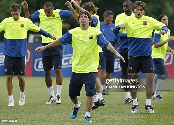 Barcelona's Argentinian player Lionel Messi leads a team training session at Bisham Abbey Sports Centre in Marlow, in southern England, on July 23,...