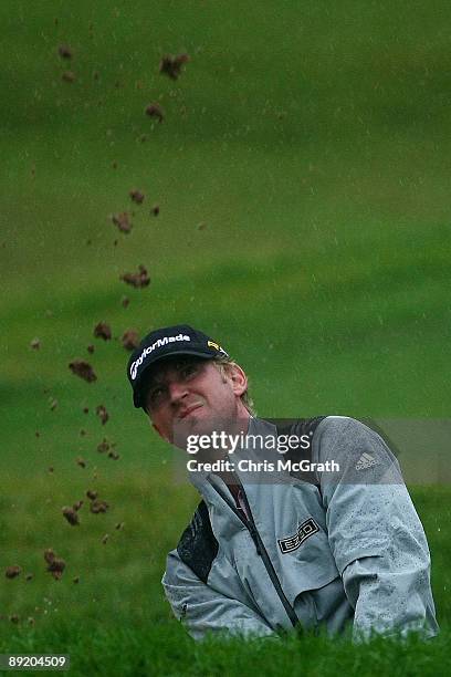 Vaughn Taylor chips out of the bunker on the fifth green before play was suspended due to inclement weather during round one of the RBC Canadian Open...
